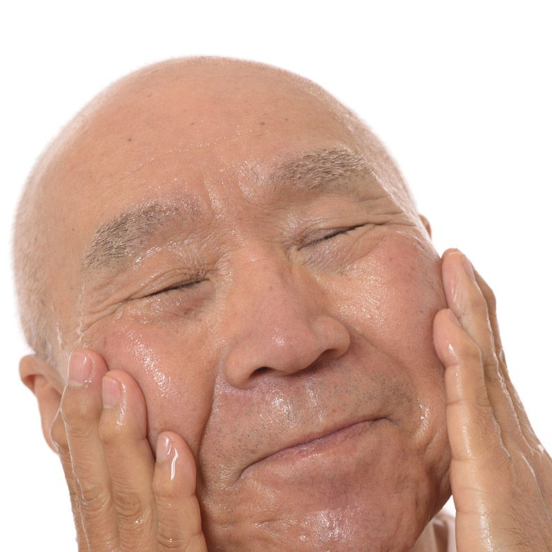 man-oiling-face Chair Yoga